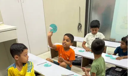 Students engaged in phonics learning activities at Smart Education