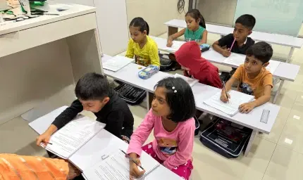 Student's phonics workbook showing letter sound practice