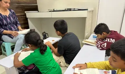 Head teacher explaining phonics concepts to students