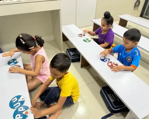 Children learning phonics and grammar in Smart Education's classroom in Mumbai with interactive materials and experienced teachers
